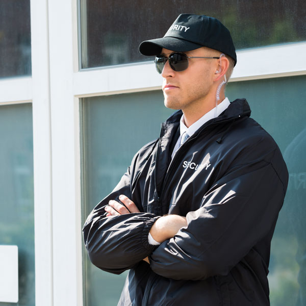man with security hat and jacket on