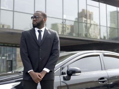 Man standing in front of car
