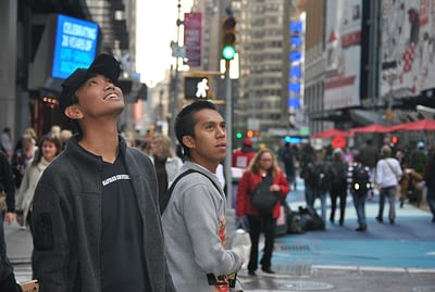 Young boy looking at sky